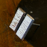 Sterling silver panel studs.