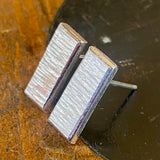 Sterling silver panel studs.