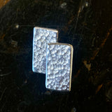 Sterling silver panel studs.