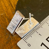 Sterling silver panel studs.